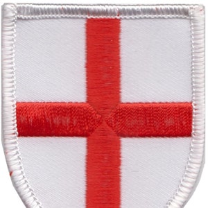 May include: A white embroidered patch with a red cross, representing the flag of England.