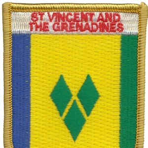 May include: A yellow, green, and blue embroidered patch with the text "ST VINCENT AND THE GRENADINES" in red. The patch features a green diamond shape with three smaller green diamonds inside.