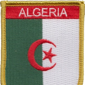 May include: A green, white, and red embroidered patch with the word "ALGERIA" in white lettering on a red background. The patch features a white crescent moon with a red star inside, on a green background.