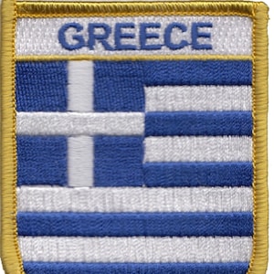 May include: Embroidered patch with the Greek flag and the word "GREECE" in white lettering on a gold background.