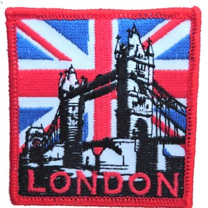 May include: An embroidered patch featuring the Union Jack flag with a black silhouette of Tower Bridge and the word "LONDON" in black lettering.