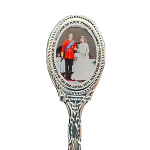 May include: Silver commemorative spoon with a round image of Prince William and Catherine Middleton on their wedding day. The image is surrounded by the text "In Celebration of the Marriage of H.R.H Prince William & Catherine Middleton on 29th April 2011."