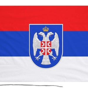 May include: A red, blue, and white flag with a coat of arms featuring a double-headed eagle and a crown.