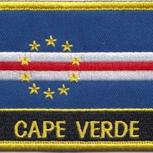 May include: A blue, white, and red embroidered patch with a circle of ten gold stars and the text "CAPE VERDE" in gold lettering on a black background.