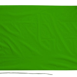 May include: A solid green flag with a white rope sewn around the edge.