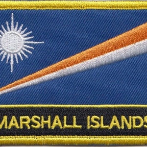 May include: A blue patch with a white sun and an orange and white diagonal stripe. The text "MARSHALL ISLANDS" is printed in yellow on a black background.