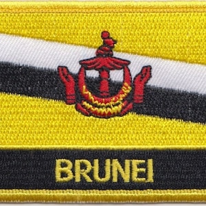 May include: An embroidered patch featuring the coat of arms of Brunei, with a yellow, black and white design. The word "BRUNEI" is embroidered in yellow lettering.