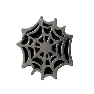 May include: A silver-colored metal spider web charm with a black enamel design.