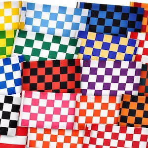 May include: A selection of checkered fabric squares in a variety of colours, such as yellow, green, blue, red, black, and orange. Each square displays a distinct checkerboard pattern, creating a vibrant and visually diverse display. The fabrics are arranged in a layered composition.