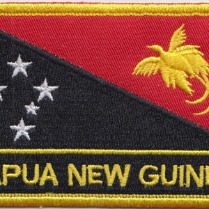 May include: Embroidered patch depicting the flag of Papua New Guinea. The design features a red background with a yellow bird of paradise, a black triangle with five white stars, and the text "PAPUA NEW GUINEA" in yellow.