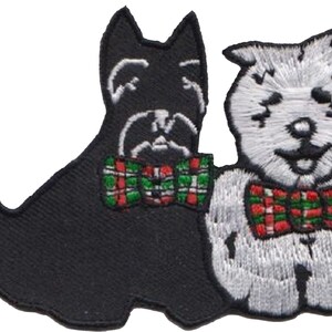 May include: Embroidered patch featuring two cartoon dogs. One is black, the other white, both wearing plaid bow ties with red, green, and white accents. The patch is designed for application on fabric.