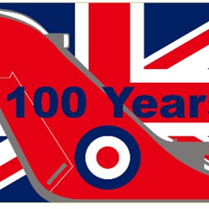 May include: A Union Jack flag with a red airplane wing design. The wing has a roundel with a red centre and a white ring. The text "100 Years" is printed in blue on the wing.