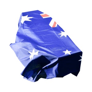 May include: A blue fabric with white stars and a red and white Union Jack in the top left corner. The fabric is crumpled and folded.