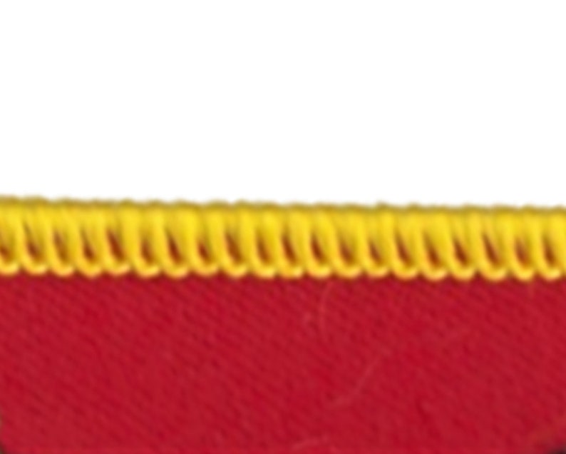May include: Red fabric with a yellow zig-zag stitch along the top edge.
