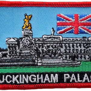 May include: A red, white, and blue embroidered patch with a depiction of Buckingham Palace and the Union Jack flag. The text "BUCKINGHAM PALACE" is embroidered in white on a green background.