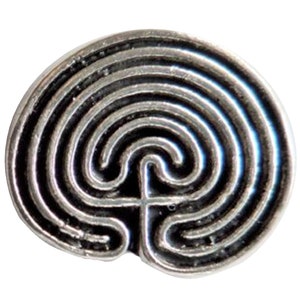 May include: Silver-toned metal charm featuring a circular labyrinth design. The labyrinth is made up of concentric circles and a central spiral.