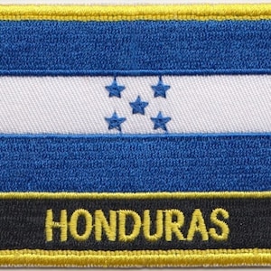 May include: Embroidered patch featuring the Honduran flag. The flag is blue, white, and blue with five white stars on the white stripe. The patch has a black border with the word "HONDURAS" in yellow letters.