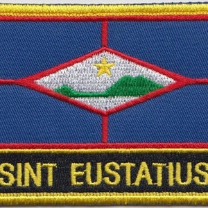 May include: A blue, red and yellow embroidered patch with a white diamond shape containing a green hill, a yellow star and the text "SINT EUSTATIUS".