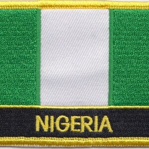 May include: A green, white, and green embroidered patch with a yellow border and the word "NIGERIA" in yellow lettering on a black background.