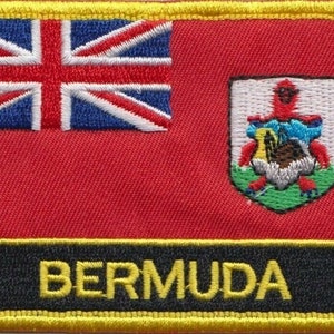 Peut inclure: Un écusson brodé représentant le drapeau des Bermudes. L'écusson est bordé de jaune et porte l'inscription "BERMUDA" en lettres jaunes sur fond noir.