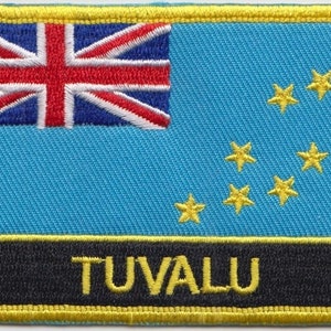 May include: An embroidered patch featuring the flag of Tuvalu. The flag has a Union Jack in the top left corner and nine yellow stars on a blue background. The word "Tuvalu" is embroidered in yellow on a black background.
