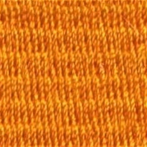 May include: A close-up of a textured orange fabric with a repeating pattern.