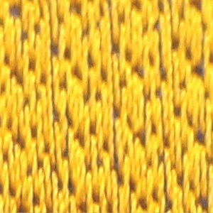 May include: Close-up of a yellow fabric with a textured, woven pattern.