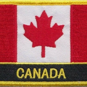 Könnte beinhalten: Ein roter und weißer kanadischer Flaggen-Patch mit schwarzem Hintergrund und dem Wort "CANADA" in gelben Buchstaben.