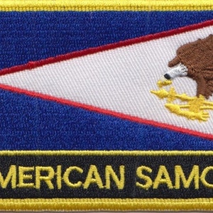 May include: A blue, white, and red embroidered patch with a brown eagle and the text "AMERICAN SAMOA" in yellow.