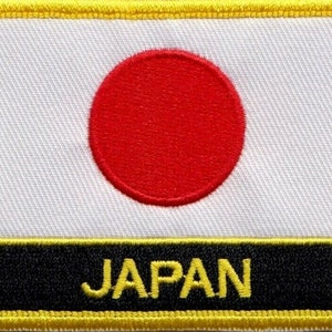 May include: A white patch with a red circle in the center and the word "JAPAN" in yellow letters on a black background.