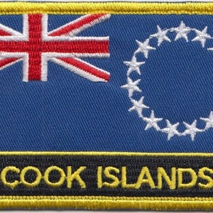 May include: Embroidered patch featuring the Cook Islands flag. The flag is blue with a Union Jack in the top left corner and a circle of 15 white stars on the right. The patch has a black border with the text "COOK ISLANDS" in yellow.