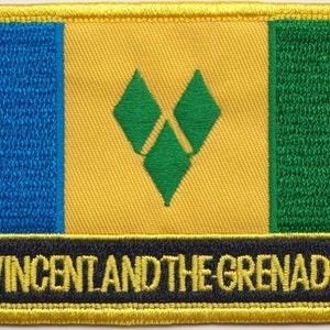 May include: A yellow, green and blue embroidered patch with the text "ST. VINCENT AND THE GRENADINES" in black.