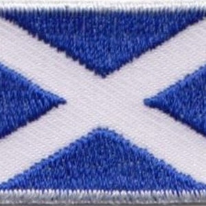May include: A white patch with a blue diagonal cross, representing the flag of Scotland.