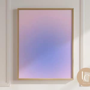 May include: A framed abstract art print with a gradient of pink, purple, and blue colors. The frame is gold and the print is in a modern style.