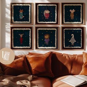 May include: Six framed art prints featuring whimsical animal illustrations. Each print showcases a different animal, including a fox, hedgehog, and mouse, dressed in clothing against a dark blue starry background. The prints are framed in wooden frames and displayed above a brown sofa.