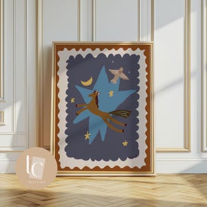 May include: A framed art print featuring a whimsical illustration. A brown horse flies through a blue star-shaped background with a crescent moon and stars. A white dove flies above the horse. The frame is brown with a cream-colored border.
