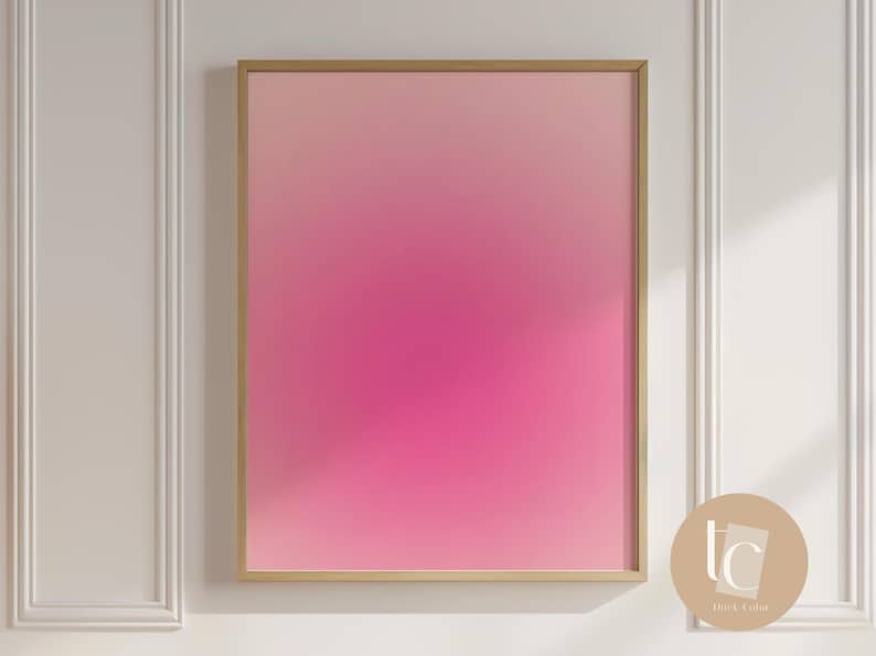 May include: A framed abstract art print with a pink to white gradient. The frame is gold.