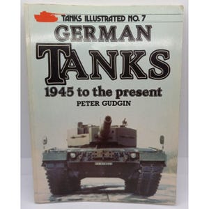 May include: A book titled "Tanks Illustrated No. 7 German Tanks 1945 to the present" by Peter Gudgin. The cover features a photograph of a German tank. The book's title is in large, bold, black letters with a white outline against a light blue background.