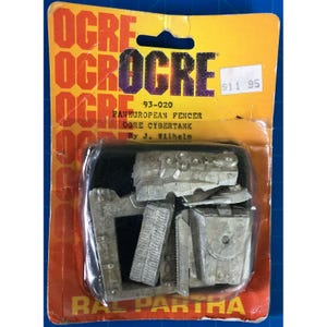 May include: A vintage Pan European Fencer Core Cybertank model kit by J. Wilhelm, packaged in a yellow and red blister pack. The kit includes several unpainted metal components. The packaging features the word "OGRE" repeated multiple times.