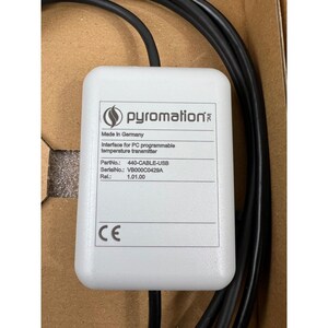 May include: A white Pyromation interface for PC programmable temperature transmitter with black cables. The device has the text "Made in Germany" and "CE" printed on it. Part number is 440-CABLE-USB.