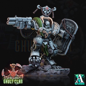 May include: A miniature armoured warrior figure in silver and grey plating with a green cape, holding a double-barrelled firearm and a large shield. The figure features intricate gold-coloured filigree, a helmeted head, and stands on a rocky base.
