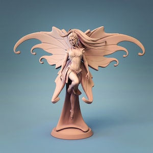 May include: A detailed figurine of a fairy with large wings, long flowing hair, and a delicate, intricate design. The fairy is standing on a base with a flowing skirt-like design.