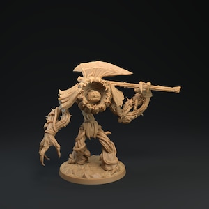 Könnte beinhalten: Eine braune, hölzerne, humanoide Figur mit einem großen, blattreichen Kopf und einem dornigen, verdrehten Körper. Die Figur hält einen langen, hölzernen Stab in ihrer rechten Hand. Die Figur steht auf einem runden, braunen Sockel.