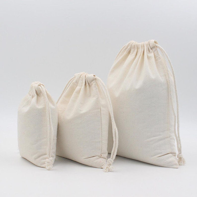 Biologische katoenen tassen. 100% biologisch katoenen tassen van premium kwaliteit met dubbel trekkoord. Ideaal voor verpakking en opslag. Selecteer maat en hoeveelheid. afbeelding 1