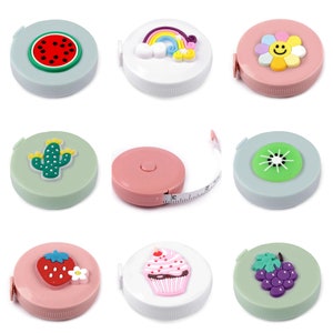 May include: Set of ten colourful measuring tapes with different cute designs, including a watermelon, rainbow, flower, cactus, kiwi, cupcake, strawberry, and grapes. Each tape measure is approximately 15 cm in diameter.