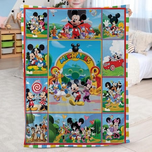 May include: A colorful blanket featuring Mickey Mouse and friends. The blanket has a grid design with various scenes of the characters. The word "MICHAELS" is visible on the blanket. The blanket is held by a child.