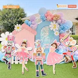 May include: A festive outdoor party scene with a pink house, blue arch, and colorful balloons. Cutout figures of a nutcracker, fairy, and mouse are featured. The text "DIGITAL FILE ONLY" and "DOWNLOAD" are visible.