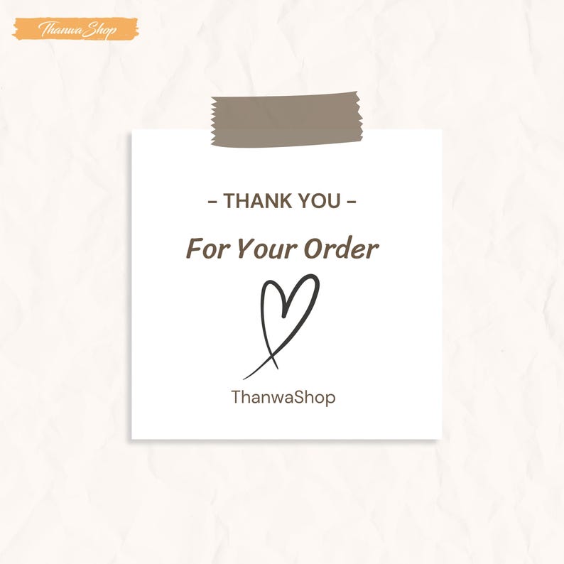 May include: A white card with the text "- THANK YOU - For Your Order" in brown font, a hand-drawn heart, and the shop name "ThanwaShop". The card is taped to a textured background.