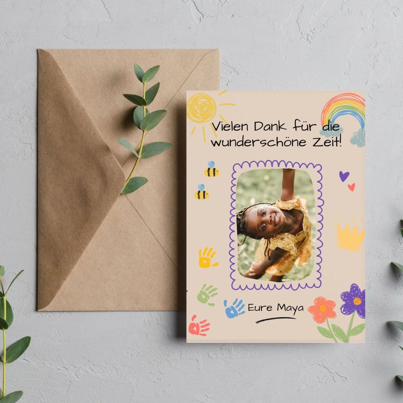 May include: A light brown card with a hand-drawn rainbow, sun, and flowers. A photo of a young girl is in the center of the card. The text "Vielen Dank f&uuml;r die wundersch&ouml;ne Zeit!" is at the top of the card. The text "Eure Maya" is at the bottom of the card.