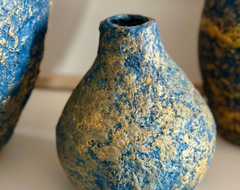 Small blue and gold papier-mâché vase.